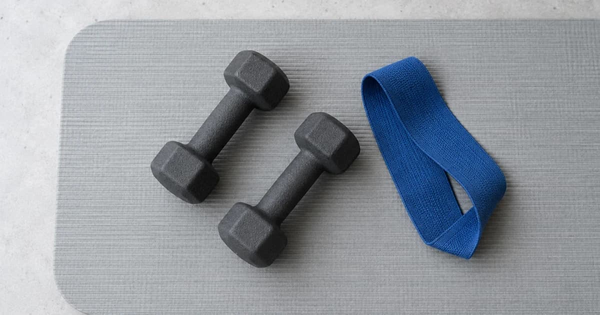 Dumbbells and a resistance band for strength exercise